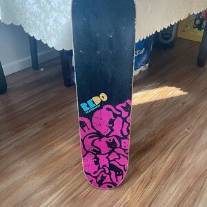 Redo Skateboard with Pink and Black Graphics
